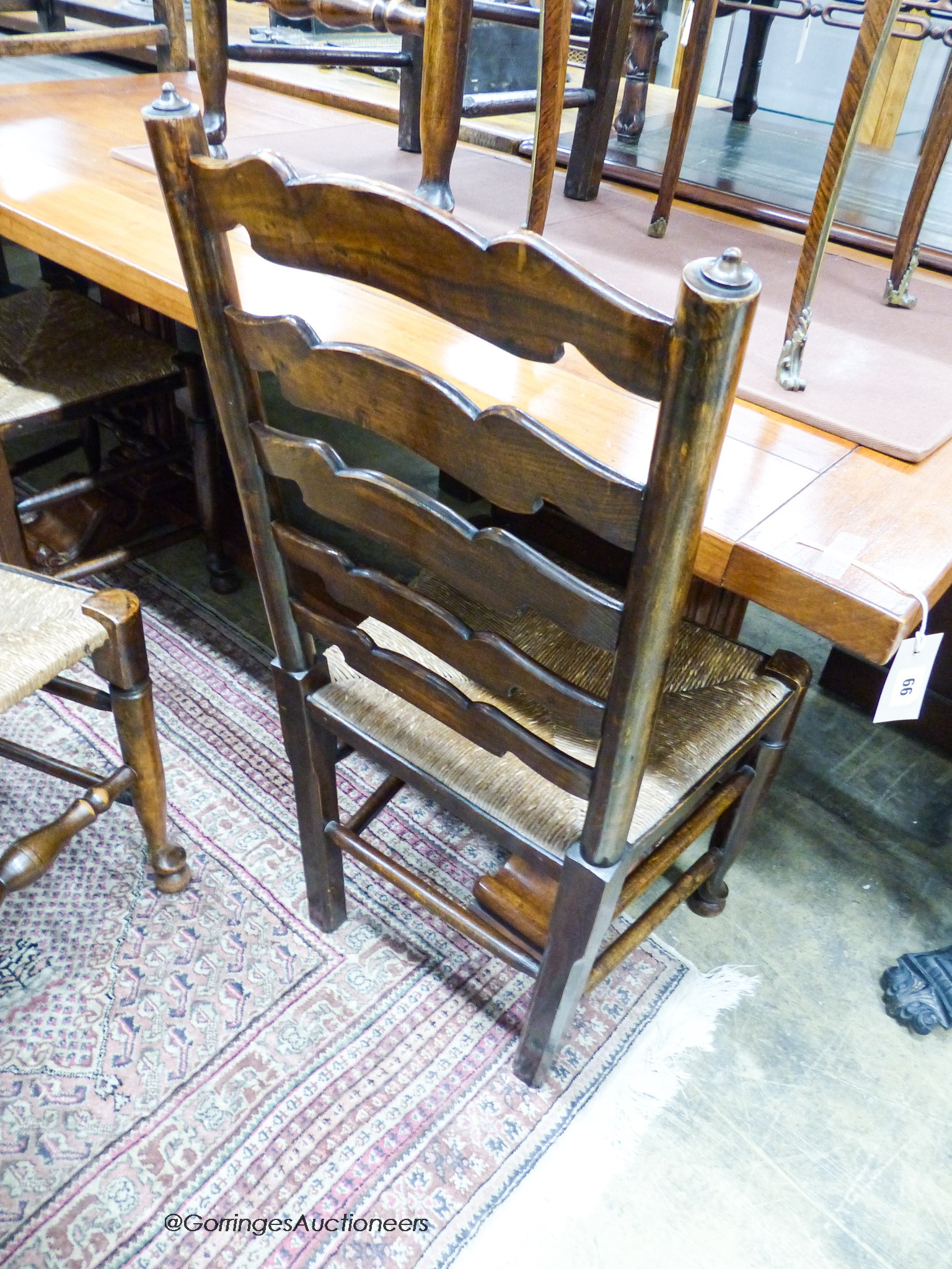 A set of four 18th century style ash rush seat ladderback dining chairs